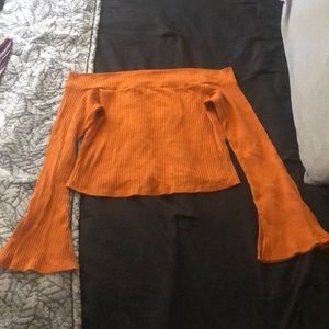 Long sleeve off the shoulder crop top.